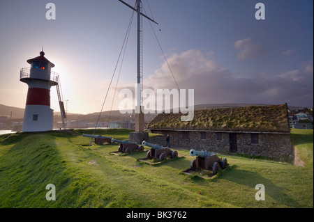 Skansin fort with old brass cannons, Second World War British marine guns and lighthouse, Torshavn, Streymoy, Faroe Islands Stock Photo