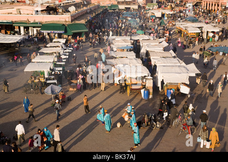 Aerial view of stalls, people and entertainers in busy Djemma el Fna square in the Medina, Marrakech, Morocco, North Africa Stock Photo