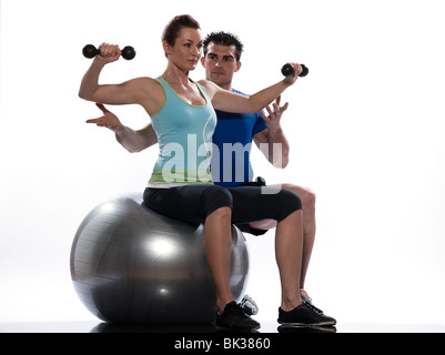 one caucasian couple man aerobic trainer positioning woman  Workout coach Posture in indoors studio isolated on white background Stock Photo