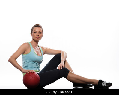 woman holding fitness ball Worrkout Posture exercise abdominals workout posture on studio isolated white background Stock Photo