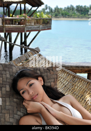 Girl on hammock, Pearl Farm Resort on Samar Island in Davao, Mindanao, Philippines, Southeast Asia, Asia Stock Photo