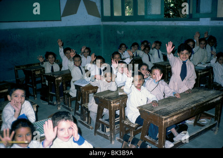 School children raising their hands, Egypt Stock Photo
