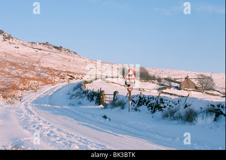 Snow covered road near Stanage Edge, Peak District, Derbyshire, UK Stock Photo