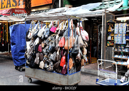 falce Louis Vuitton woman handbags before a shop, Chinatown