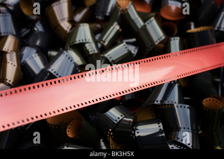 Coils of undeveloped, generic 35mm film emulsion, an antiquated analogue technology replaced by the digital camera pixel Stock Photo