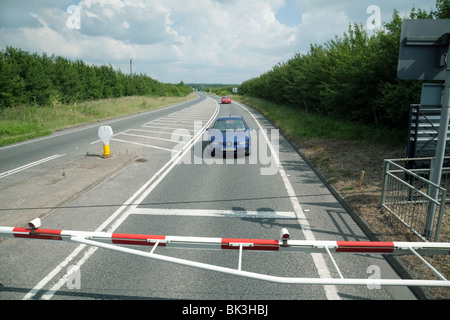 Cars waiting at a Level Crossing, seen from the train, Oxfordshire, UK Stock Photo