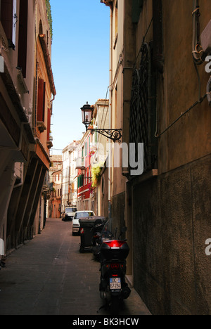 Typical narrow street of Italian town (Chioggia) Stock Photo