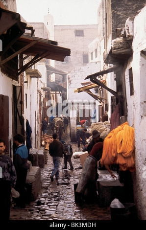 Narrow cobblestone city street scene in Ouarzazate Province, Morocco, North Africa Stock Photo