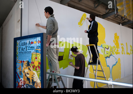 Paris, France, Group French Teens Painting Wall Mural 'Gare d'Austerlitz' Train Station, street art, People, urban youths, artwork Job Stock Photo