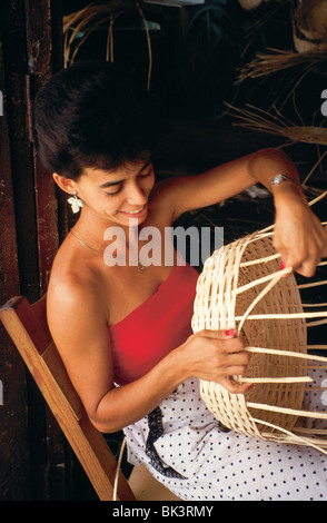 Portrait of a woman sitting and weaving baskets in Pinar del Río Province in the town of Vinales, Cuba Stock Photo