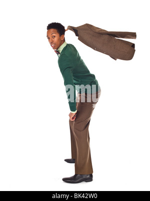 A model-released full-length portrait of a hip, stylish, young african american man in a suit with bow tie. Stock Photo