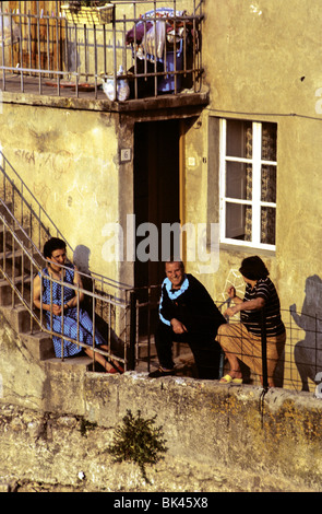 Neighbors on their balconies during late afternoon or early evening, Croatia Stock Photo