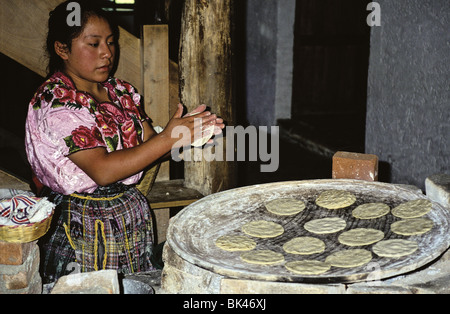 Cook preparing corn-flour tortillas, Guatemala Stock Photo