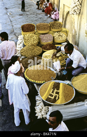 Indian marketplace with grains & spices showing ancient charm symbol of a right-handed swastika (meaning good fortune luck & Stock Photo