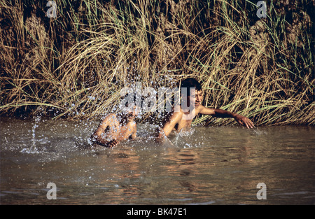 Boys cooling-off in a river near Baghdad, Iraq Stock Photo