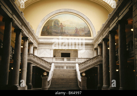 Interior hallway steps & mural in Capitol Building in Salt Lake City Utah epic paintings around arches & rotunda represent Stock Photo