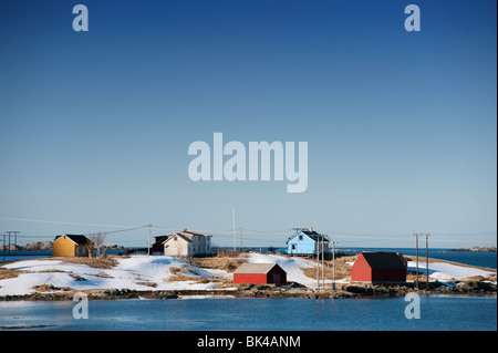 Brightly painted colourful wooden houses by the sea in Eggum on Lofoten Islands in Norway Stock Photo