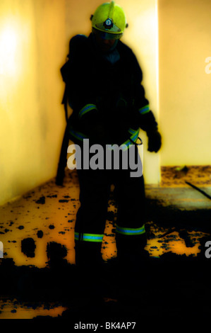 Silhouette of firefighter fighting fire Stock Photo - Alamy