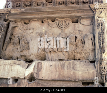 Rome Italy - Sculpture on the Arch of Titus depicting sacking of Jerusalem in year 70 AD by Romans during First Jewish-Roman War Stock Photo