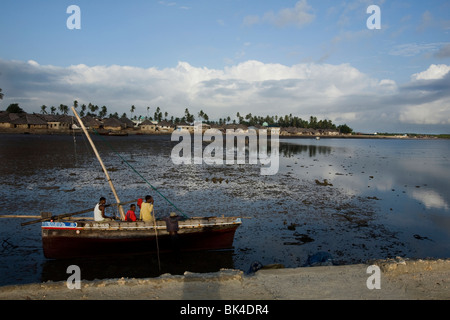 A sailing dhow on a low tide beach in the village of Kizingitini, Pate island on October 1, 2009 in the Lamu archipelago, Kenye. Stock Photo