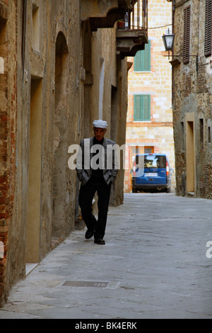 A man walking alone in an alley Stock Photo