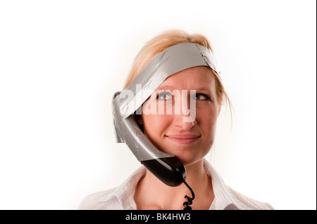 Phone handset taped to head FULLY MODEL RELEASED Stock Photo