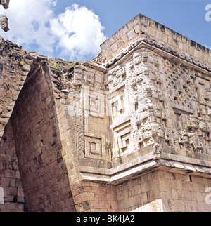 A corbel arch and relief sculpture depicting the masks of the rain god Chaac on the Governor's Palace in Uxmal, Mexico Stock Photo