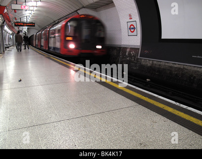 London tube train entering into station Stock Photo