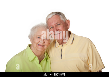 Happy elderly Caucasian couple posing on white background. Stock Photo