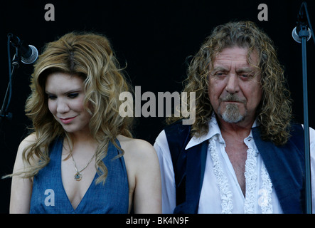Robert Plant and Alison Krauss perform during a concert. Stock Photo