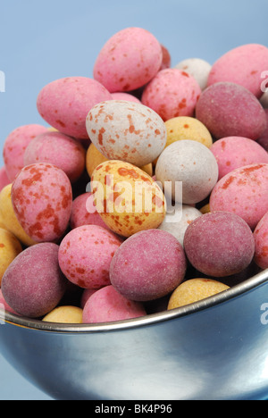 A bowl of mini candy-covered chocolate Easter eggs.
