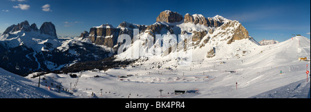 panoramic image of Dolomites mountains in winter, Italy, Belvedere ski area with view over the Gruppo Sella and Sassolungo Stock Photo