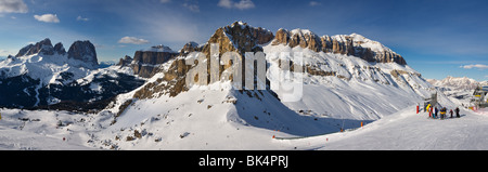 panoramic image of Dolomites mountains in winter, Italy, Belvedere ski area with view over the Gruppo Sella and Sassolungo Stock Photo