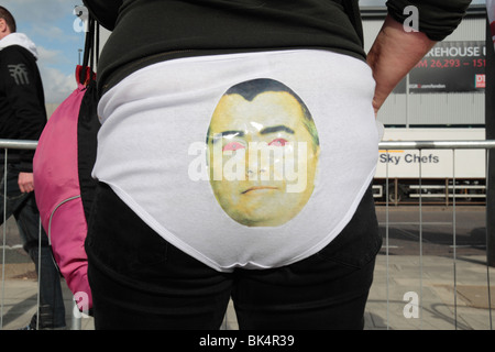 Willie Walsh face mask on bum/rear of British Airways cabin crew member protesting during the industrial action of March 2010. Stock Photo