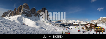 panoramic image of Dolomites mountains in winter, Italy, view of Sassolungo with Col Rodella ski area, Sella Ronda Stock Photo