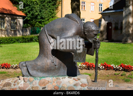 Old man and his lantern. Famous sculpture in city of Cesis in Latvia. This man who goes through the ages. Stock Photo