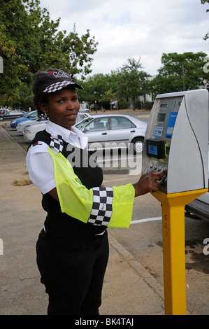 Portrait of parking meter attendant with the payment machine in Stellenbosch town centre western Cape South Africa Stock Photo