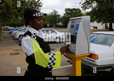 Portrait of parking meter attendant with the payment machine in Stellenbosch town centre western Cape South Africa Stock Photo