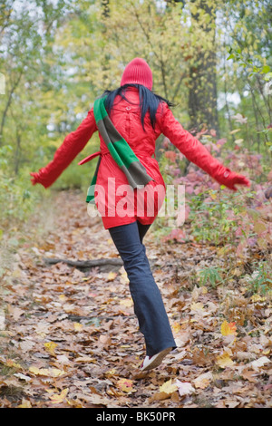 Woman Walking in Forest Stock Photo