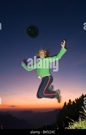 Girl Jumping in Air, Untersberg, Bavaria, Germany Stock Photo