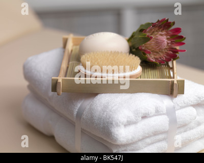 Towels with Soap and Brush on Tray Stock Photo