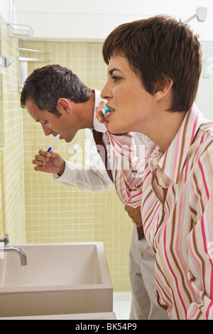 Couple Brushing Teeth Stock Photo