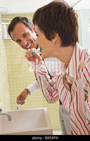 Couple Brushing Teeth Stock Photo
