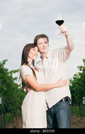 Wine Makers Examining Glass of Wine Stock Photo