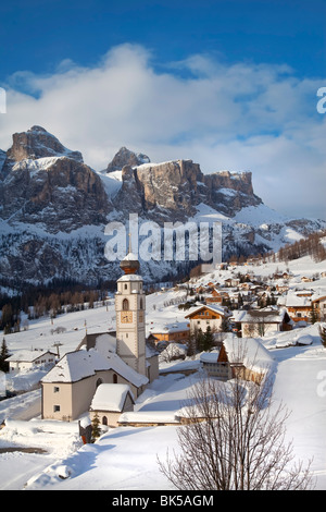 The church and village of Colfosco in Badia and Sella Massif range of mountains, South Tirol, Trentino-Alto Adige, Italy Stock Photo