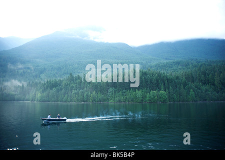 Two men troll for fish on Ross Lake, North Cascades National Park, Washington, United States of America, North America Stock Photo