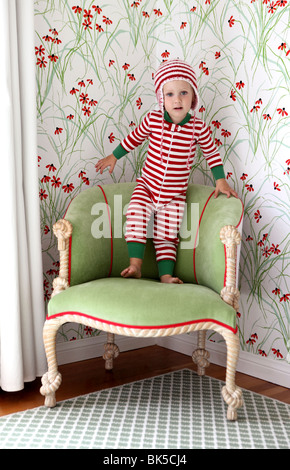 Little girl in red and white striped pajamas Stock Photo