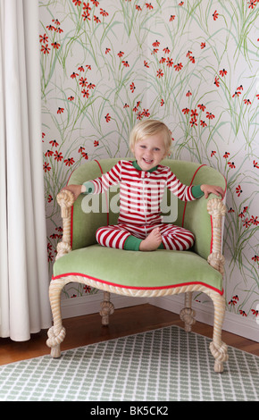 Little girl in red and white striped pajamas Stock Photo