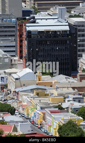 Cape Town South Africa city centre buildings tower above the historic colourful buildings in the Malay Quarter Stock Photo