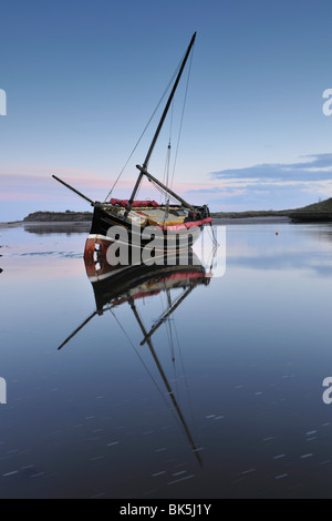 Old ketch reflecting in Aln Estuary as tide rises, Alnmouth, Northumberland, England, United Kingdom, Europe Stock Photo